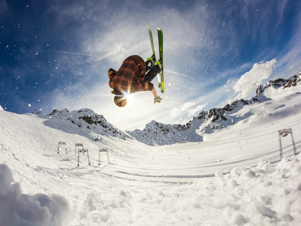 A skier doing a flip in the air. 