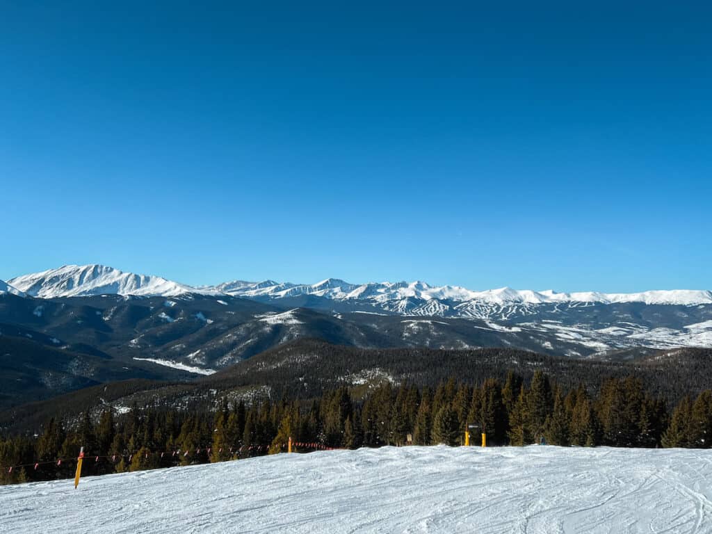 Ski resorts with bright blue skies above.