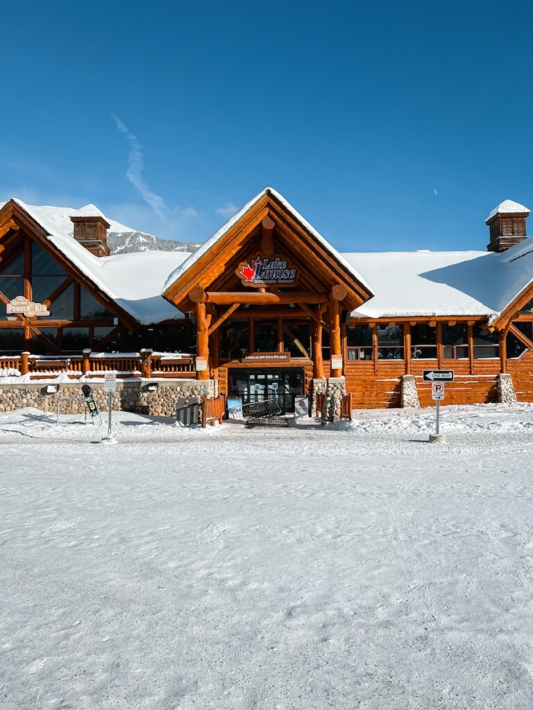 Lake Louise Lodge with blue skies above.