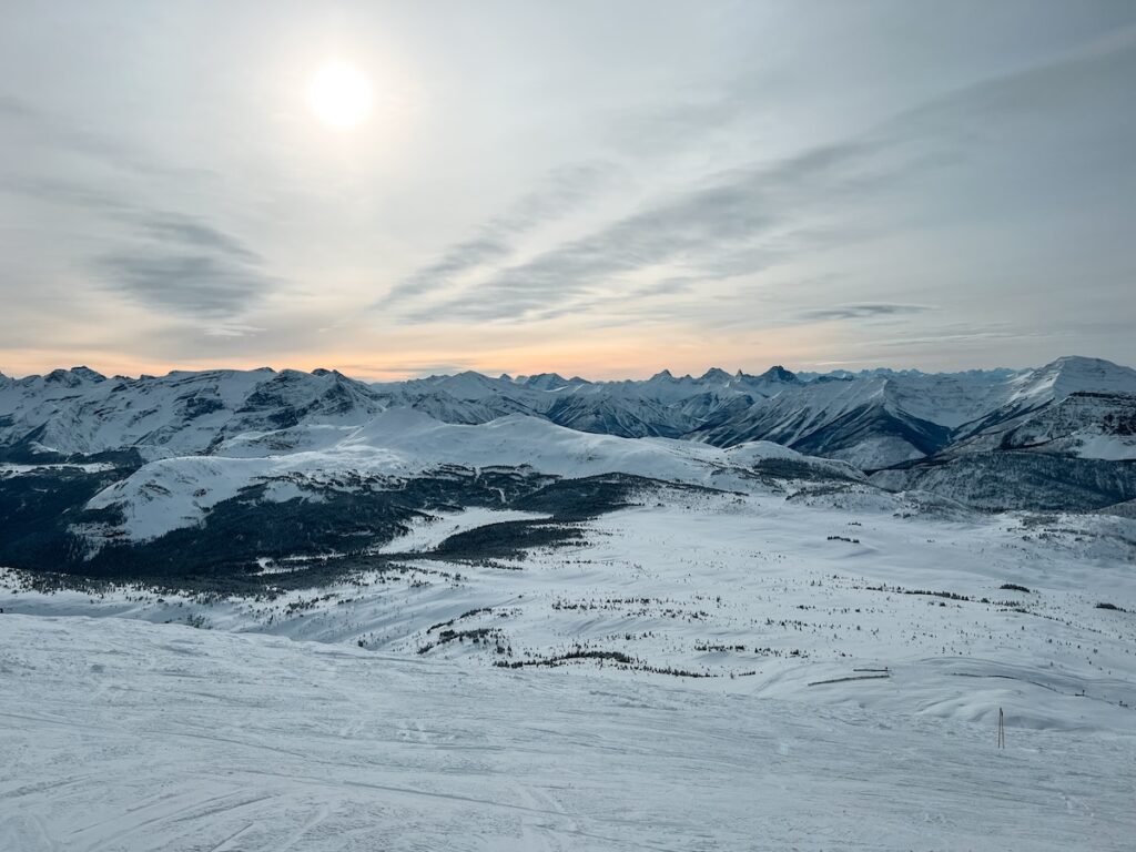 The sun rising at a ski resort in Banff.