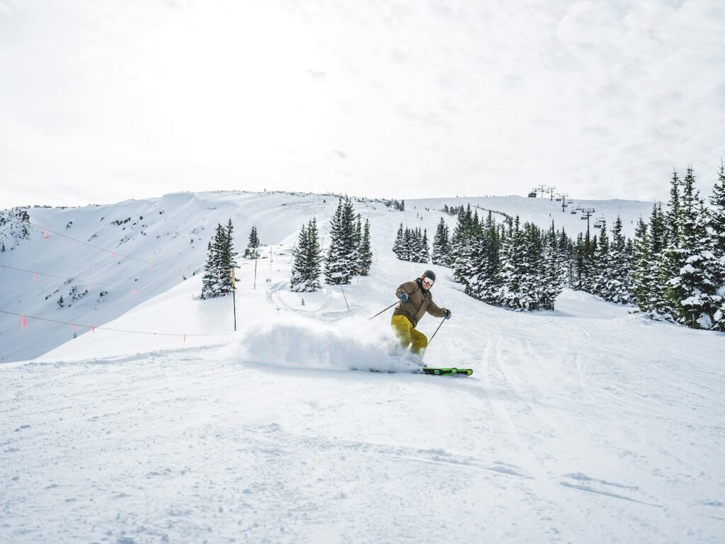 A skier cruising down the slopes in Colorado.