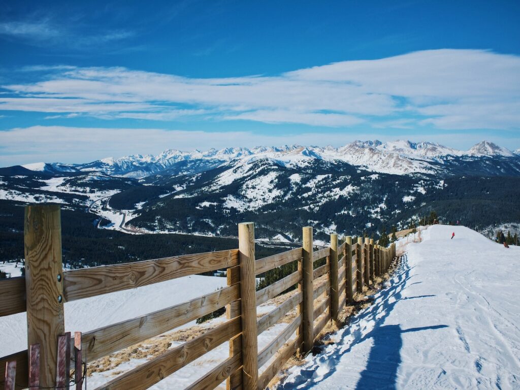 One of the best ski resorts in the United States with mountains off in the distance.