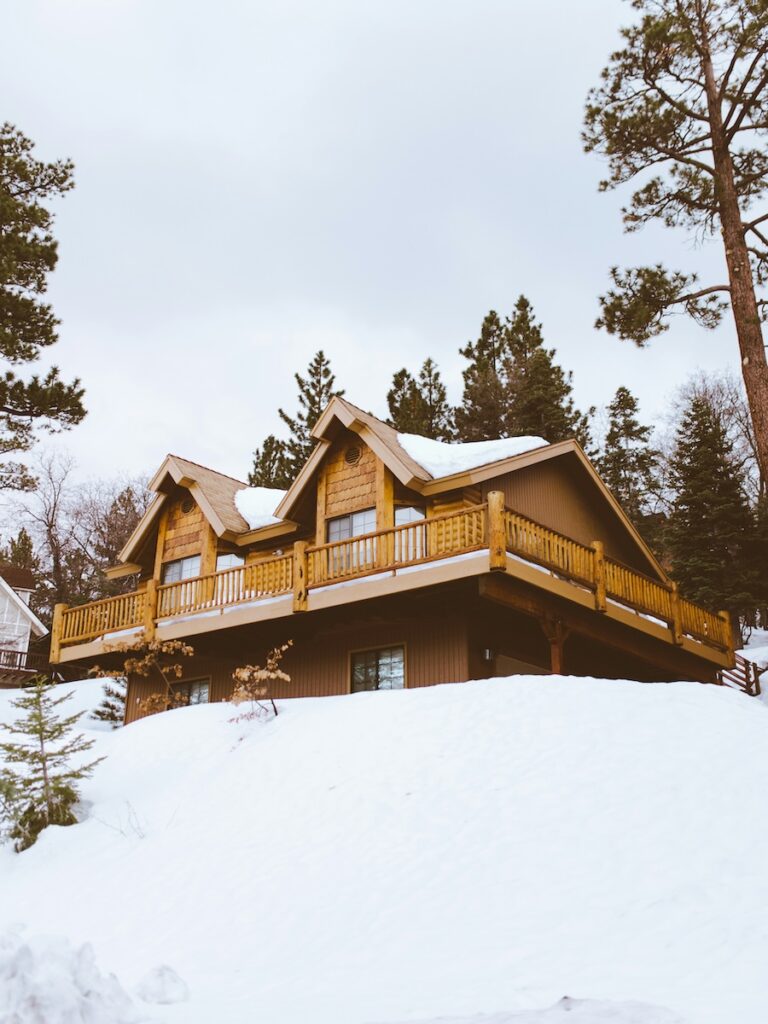 A Ski In Ski Out cabin surrounded by snow.