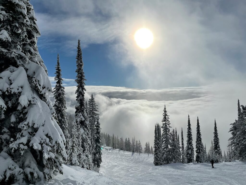 Whitefish, Montana ski slopes with partially cloudy skies. 