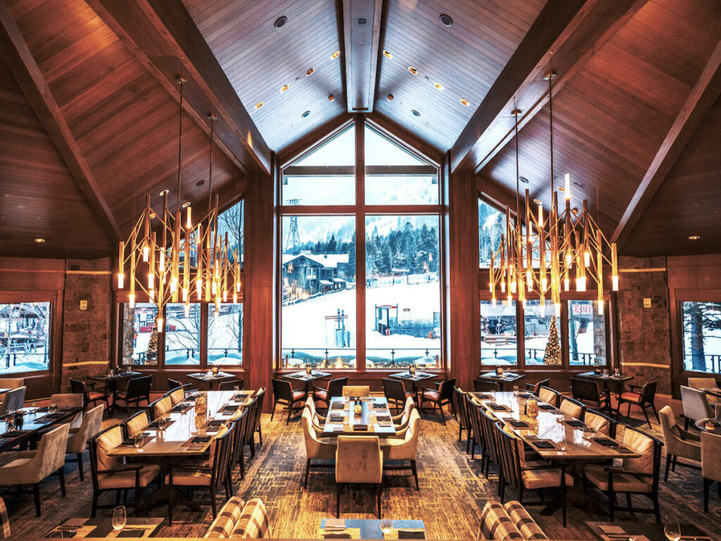 Inside the Four Seasons Jackson Hole looking out at the ski slopes.