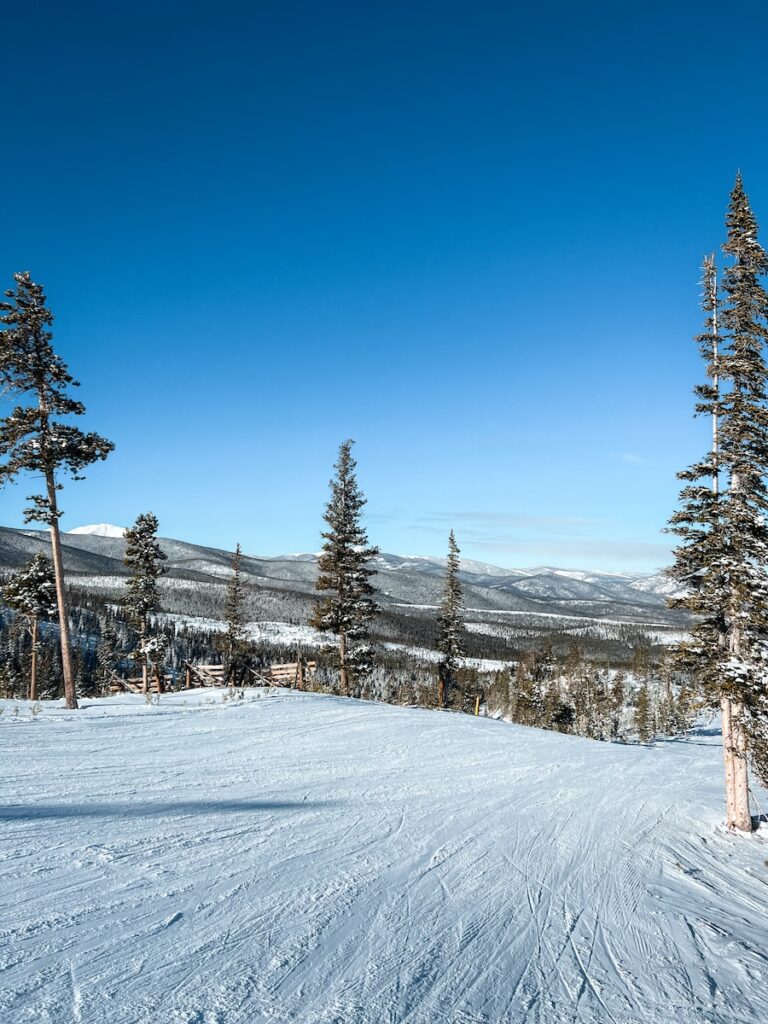 A groomed ski slope at Keystone with blue skies.