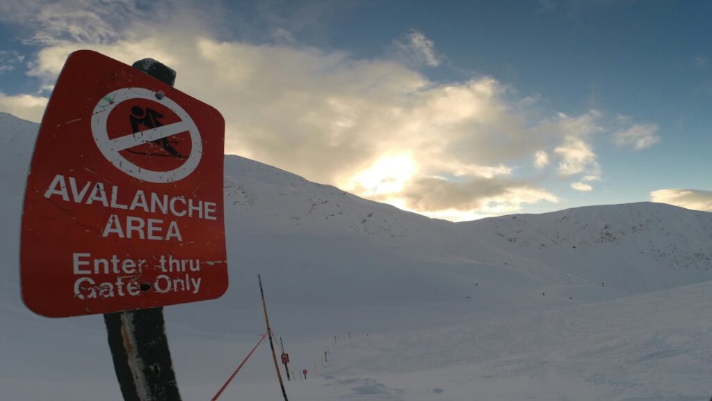 A red avalanche area sign at Alyeska Resort in Alaska.