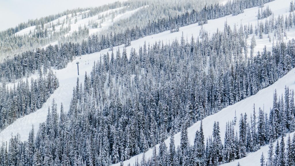 Ski slopes in Aspen, Colorado covered in snow.