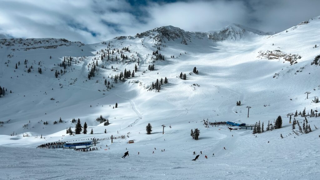 Snowy ski slopes in Utah on a cloudy day.