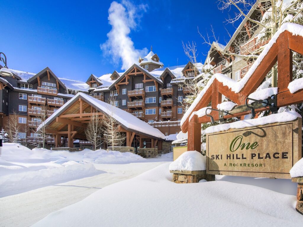 One Ski Hill Place surrounded by snow on a bluebird day.