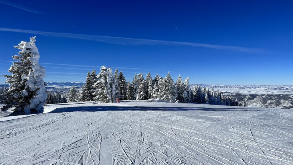 A groomed run at Steamboat Springs on a bluebird day.