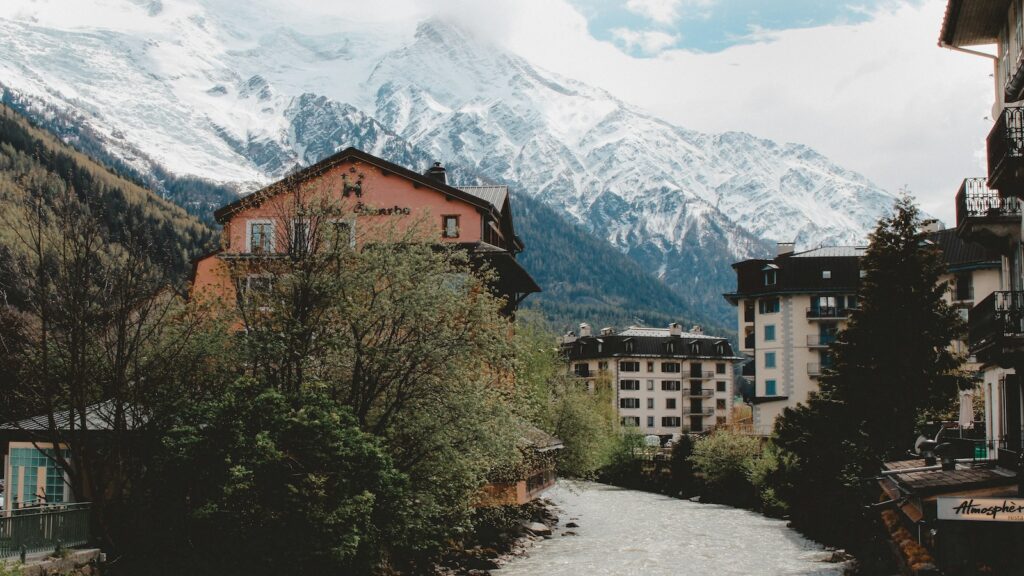 Building with snow mountains in the backdrop in Chamonix.