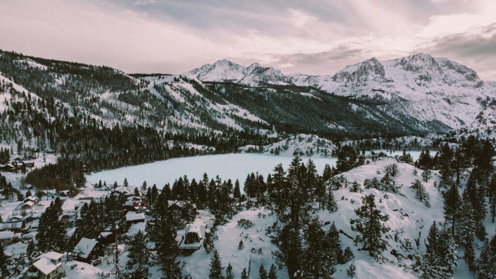 Views of a lake in California with the ski resort off in the distance.