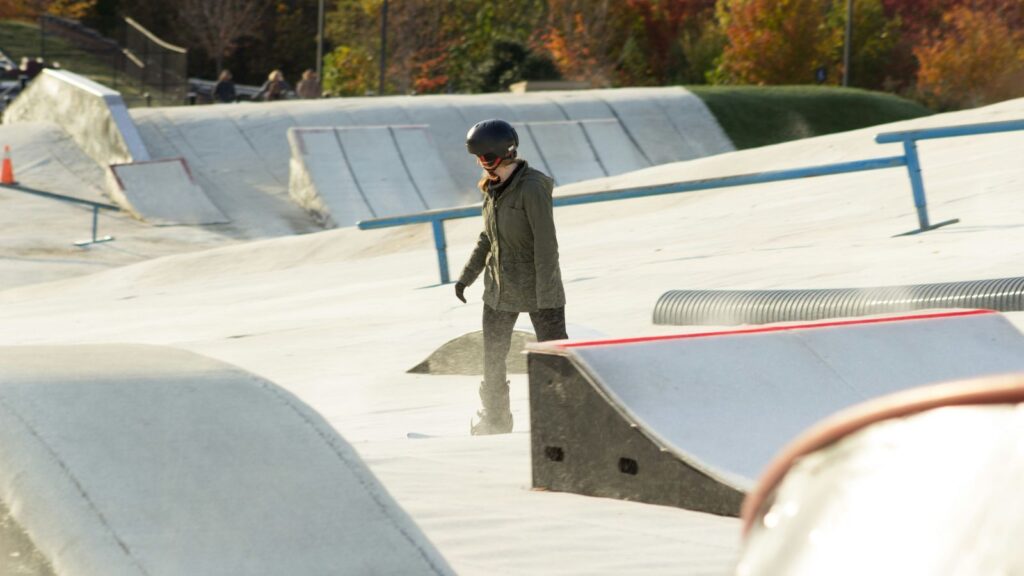 A snowboarder going down the mountain at Snowflex.