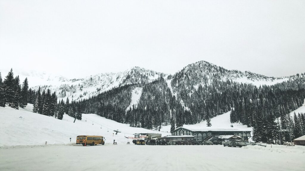 Whitewater Ski Resort with snow and trees lining the slopes.