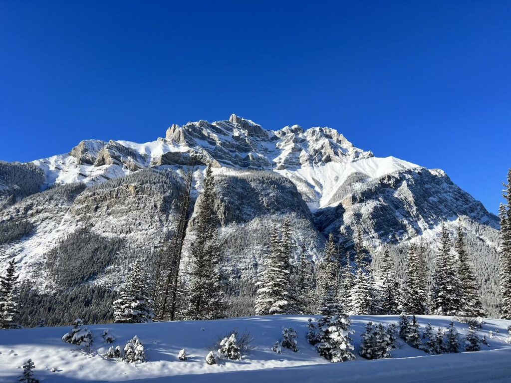 Snowy mountain with blue skies in Banff National Park.