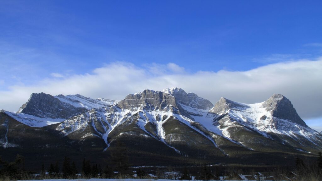 Mountains dusted in snow in Canmore, Canada.