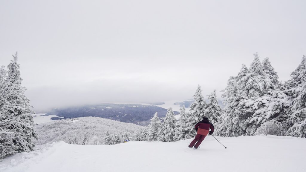 A skier in Maroon at Mount Sunapee.