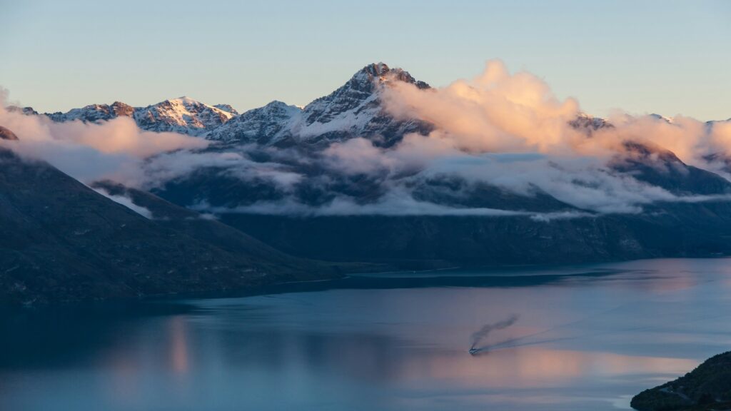 Queenstown mountains surrounded by clouds.