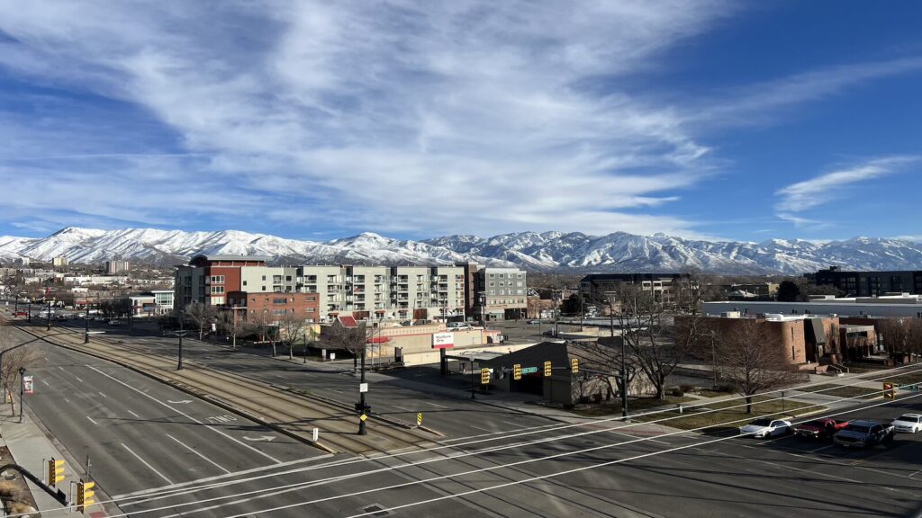 Downtown Salt Lake City surrounded by snow covered mountains.