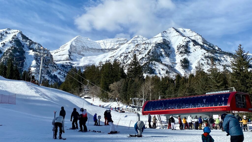 A chairlift at Sundance with large mountains behind it.