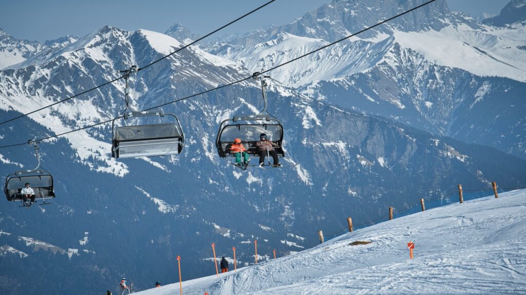 Skiers on a chair lift at Pizol.